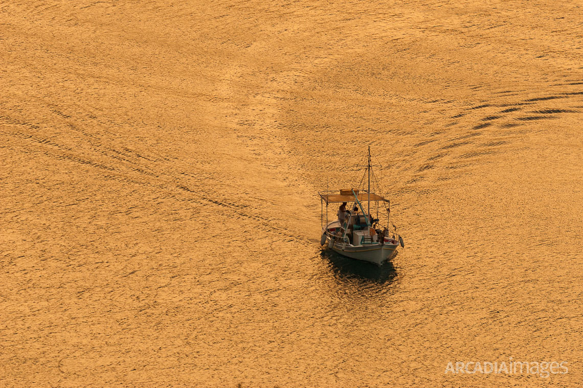 A fishing boat at Tyros town during sunrise. Arcadia, Peloponnese, Greece